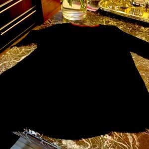 Polyester long swing top three-quarter sleeves , pockets on sides longer back